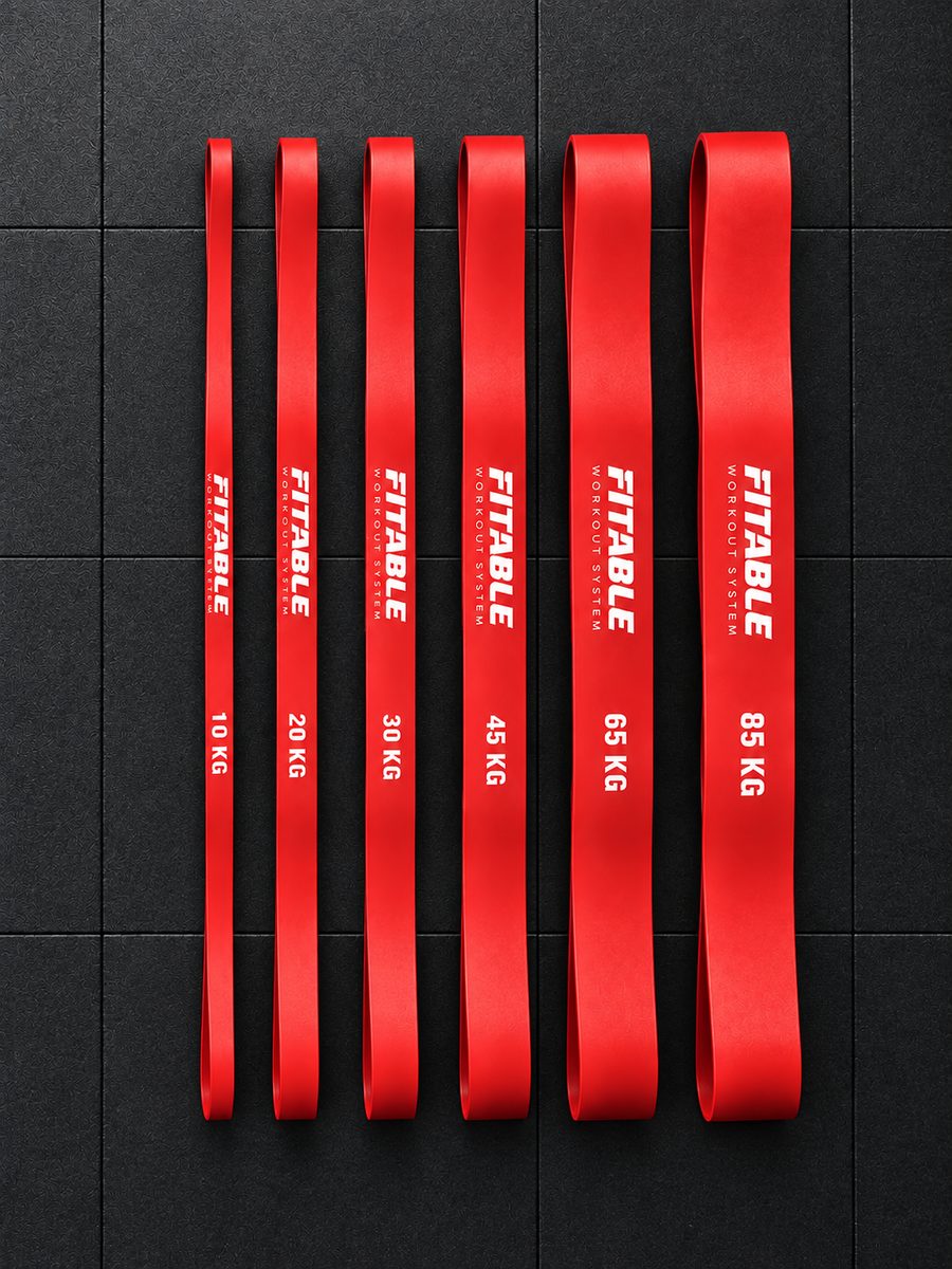 Fitable bar, hooks and all 6 resistance bands laid out by weight