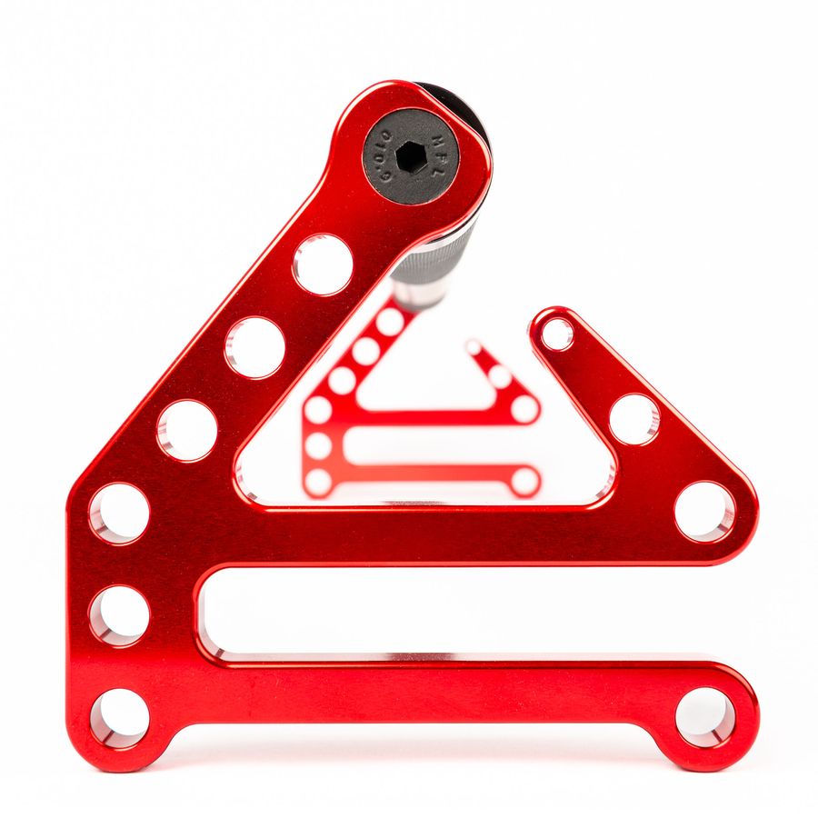 Close-up of the machined aluminium Fitable hook end, anodised red, with the row of holes used to set band length